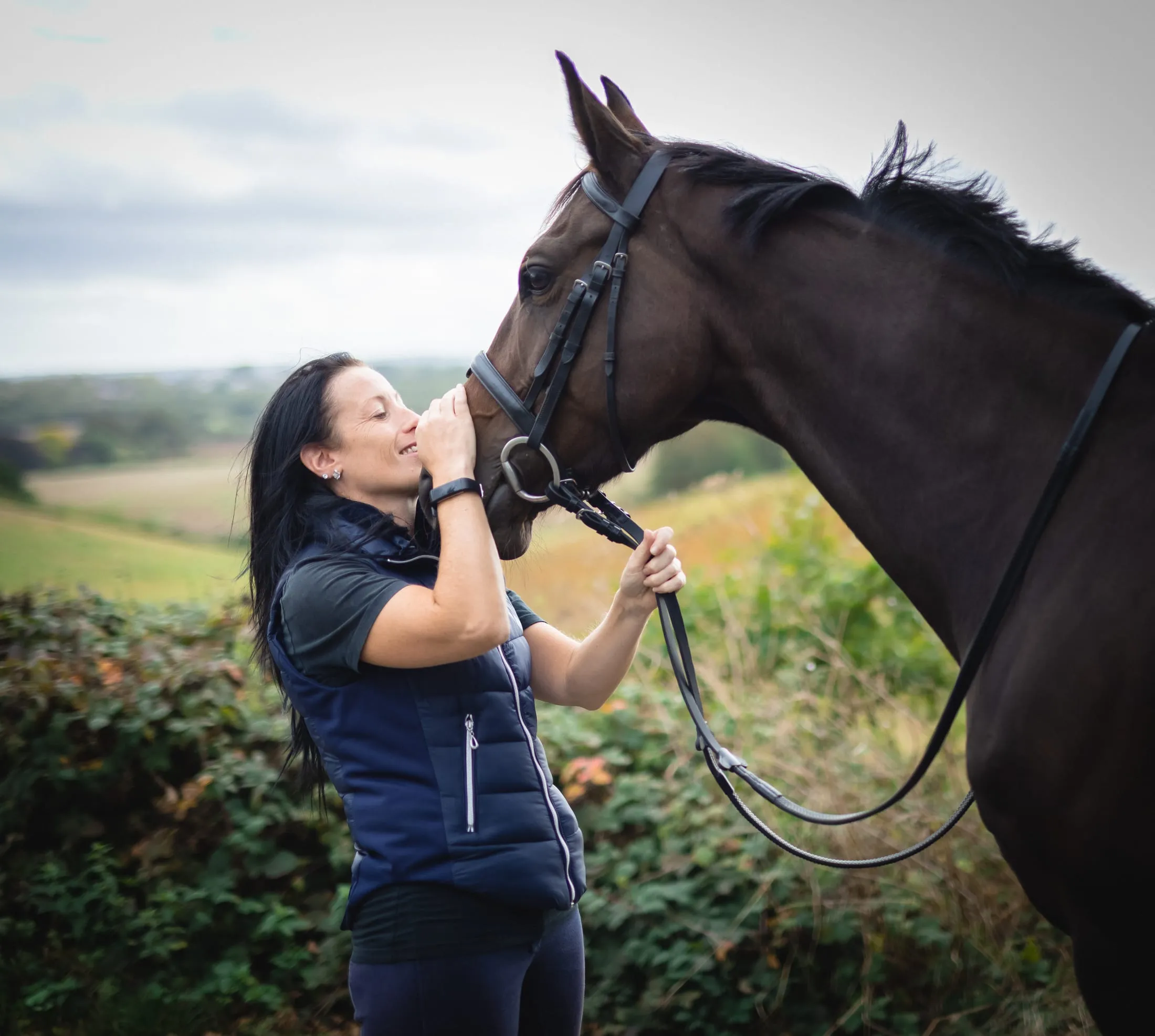 A quiet, low-light photography session, owner and horse