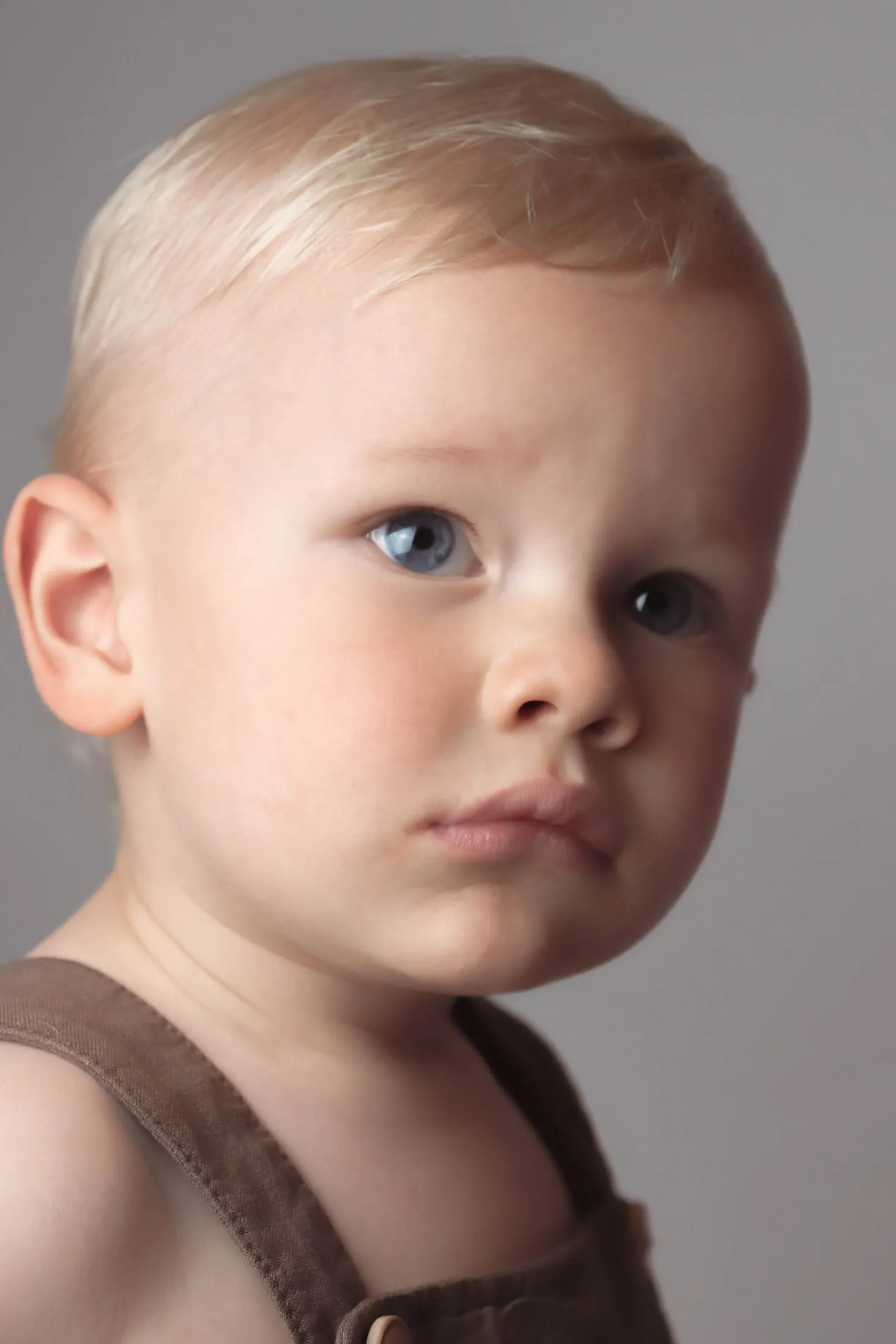 Close-up studio portrait of a young boy